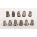 Eleven 19th Century and later silver thimbles, mostly French, including an example with berried