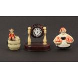 Three novelty celluloid tape measures, comprising a mantel clock, replacement plain brass tape,