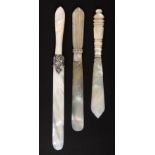 Three mother of pearl paper knives in the style of Palais Royal, including one with leaf scroll