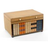 An unusual German 'library' paper covered sewing box, circa 1840, of rectangular form the front with