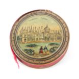 An early Tunbridge ware print and paint decorated disc form pin cushion, each domed side with titled