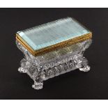 A French glass and gilt metal mounted casket, circa 1830, of bombe form raised on lion paw feet,