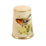 A Royal Worcester porcelain puce ground thimble, unmarked, painted with a red breasted bird on a