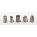 Five 18th Century English silver thimbles, comprising a steel top example, makers mark only 'WW',