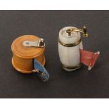 Two tape measures, comprising a mother of pearl barrel form example with coffee grinder handle,