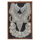 Two glazed and framed displays of lace and white work, comprising nine individual pieces, frames, 40