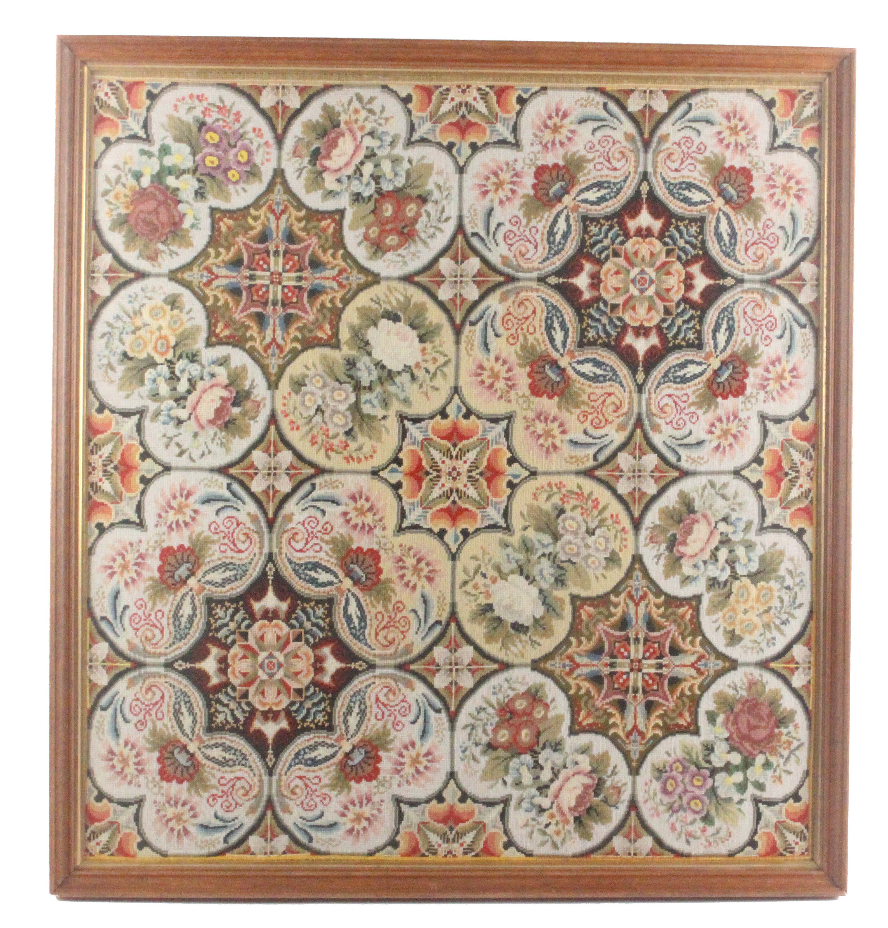 An elaborate Victorian wool work tapestry panel, worked with geometric ...