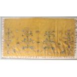 A portion of an 18th Century yellow silk shawl or cover, worked in brightly coloured silks with