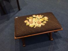 A mahogany needlework stool