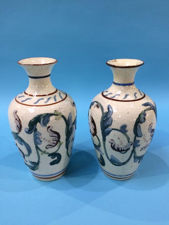 A pair of slipware style vases, 21cm height