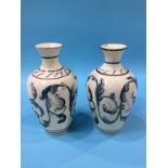 A pair of slipware style vases, 21cm height