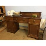 An Edwardian mahogany bow front sideboard