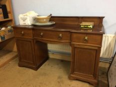 An Edwardian mahogany bow front sideboard