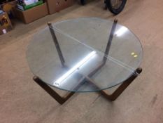 A teak and glass circular top coffee table