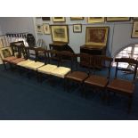 A set of nine 19th century mahogany single dining chairs, with solid splats and turned fluted and