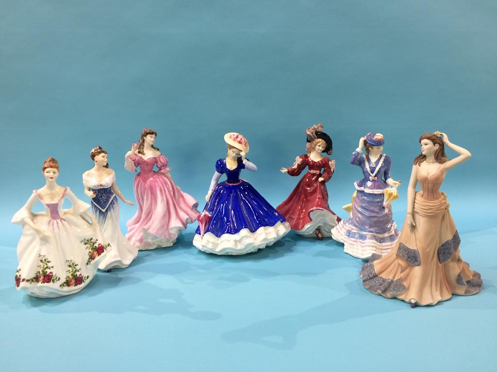 Six Royal Doulton figures and one Coalport figure