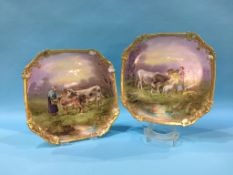 A pair of French porcelain wall plates, decorated with a lady feeding her cattle, printed mark M.