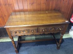 An oak two drawer side table