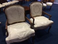 A pair of mahogany open armchairs