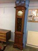 An oak cased Art Nouveau long case clock in the style of Charles Rennie Mackintosh, with silvered