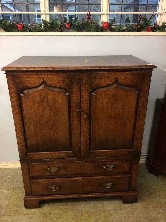 An oak two door cabinet, 100cm wide