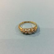 An 18ct gold five stone diamond ring, 2.3g, size 'J'