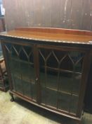 A mahogany bow front china cabinet