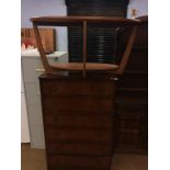 Teak oval occasional table and an oak chest of drawers