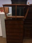 Teak oval occasional table and an oak chest of drawers