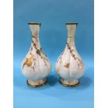 A pair of Royal Worcester vases, numbered 582, decorated with gilded butterflies and cranes, green