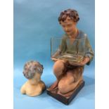 An Art Deco plaster figure of a boy holding a fish bowl and a smaller bust, 52cm height