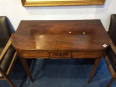 A 19th century mahogany fold over tea table