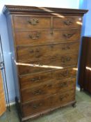 A mahogany straight front secretaire chest with dentil cornice, two short and one long drawer, below