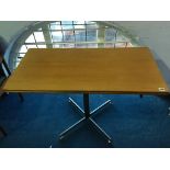 A teak McIntosh and Co. Ltd swivel top fold over table, supported on a chrome base