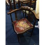 An Edwardian mahogany corner chair