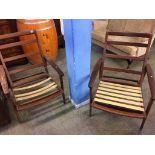 A pair of Guy Rogers teak armchairs