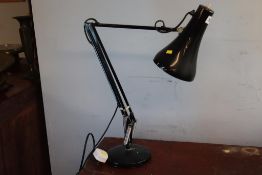 A black angle poise lamp