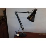 A black angle poise lamp