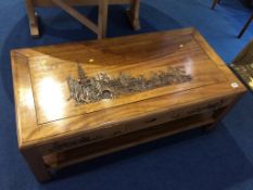 An Oriental carved low coffee table