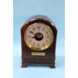 A Boulle patent battery operated bracket clock, with silvered dial and mahogany case, 31cm height