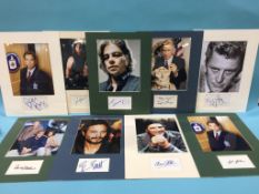 Assorted mounted photos and signed cards, to include Kurt Russell, Kirk Douglas, Lloyd Bridges,