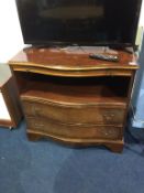 A walnut serpentine fronted chest