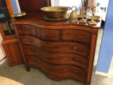 A 19th century mahogany serpentine front chest of drawers, with three short drawers, below three