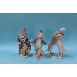 A Lladro group, 'Warm Welcome' and two clowns, boxed