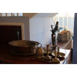 An Oriental shallow brass bowl and two pairs of candlesticks etc.