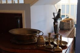 An Oriental shallow brass bowl and two pairs of candlesticks etc.