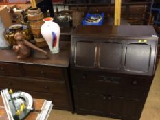 An oak bureau and an oak chest of drawers