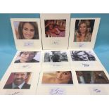 Assorted mounted photos and signed cards to include Cheryl Tiegs, Carmen Electra, Penelope Cruz,