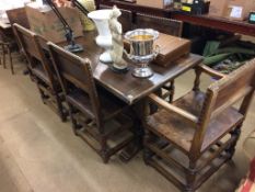 An oak refectory table and six chairs