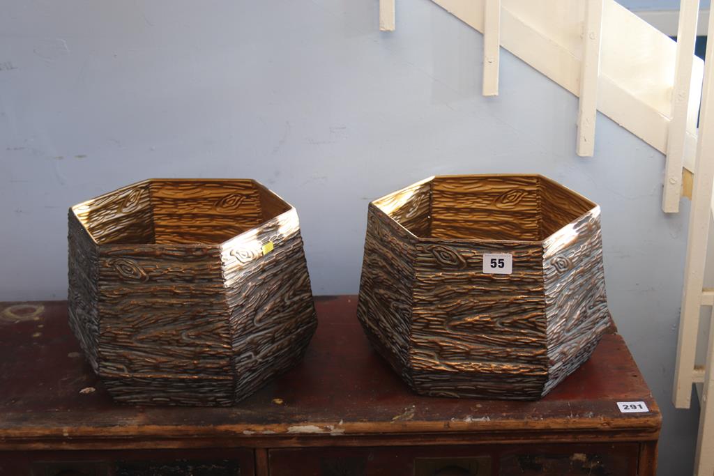 A pair of metal octagonal planters